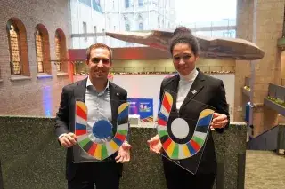 Philipp Lahm and Celia Sasic in suits holding the volunteer logo in their hands Philipp Lahm und Celia Sasic mit dem Volunteer Logo zur UEFA EURO 2024